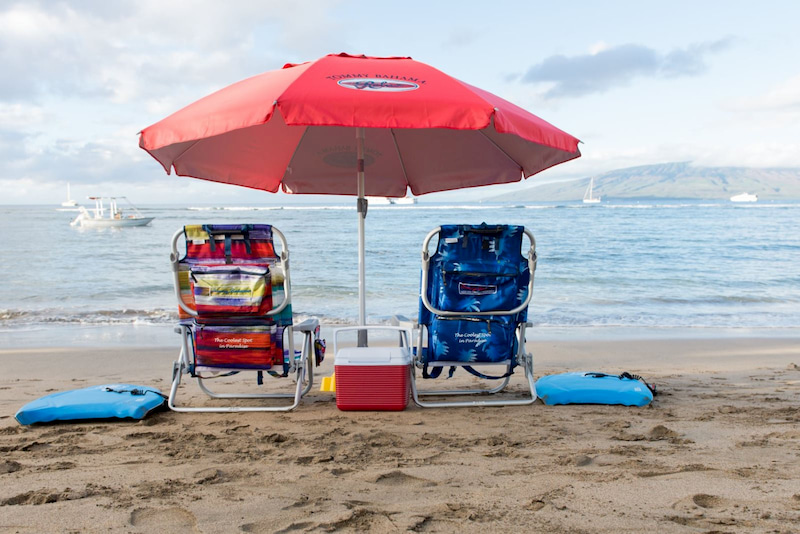 Tommy Bahama beach chairs and umbrella on the beach in Lahaina, Maui, Hawaii