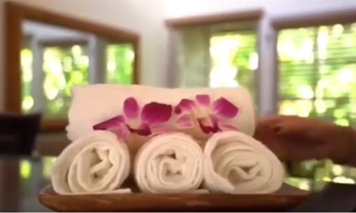 Cold towels with an orchid bloom provided by Coconut Condos for their Maui vacation rental guests