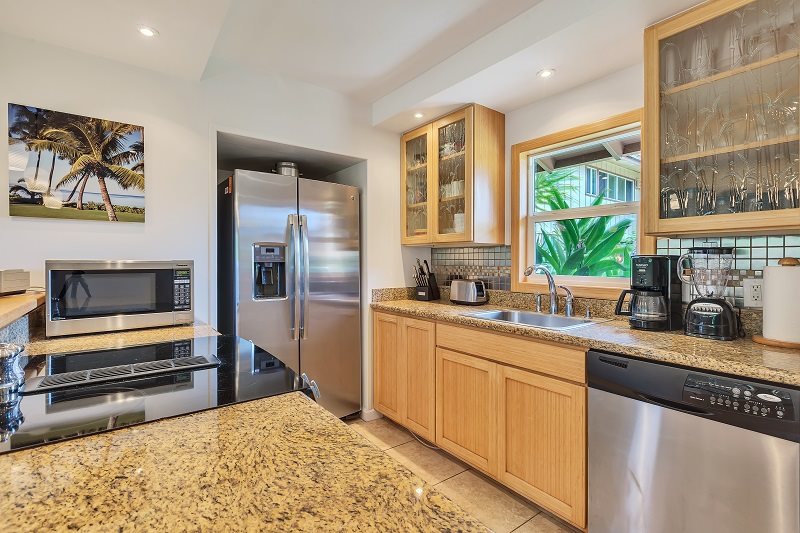 Maui vacation rental condo kitchen, fully shocked with modern appliances, cookware, dishes, silverware 