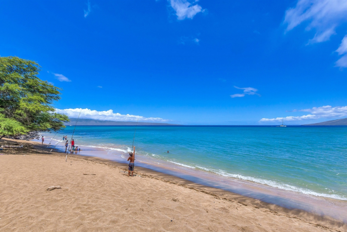 Kahana Beach, Maui, kids fishing at the beach.